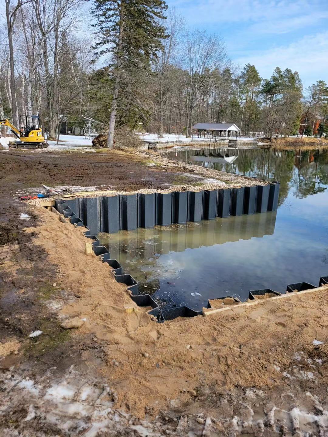 ESC vinyl sheet piling installed in freshwater setting showing corrosion resistant alternative to steel sheet piles