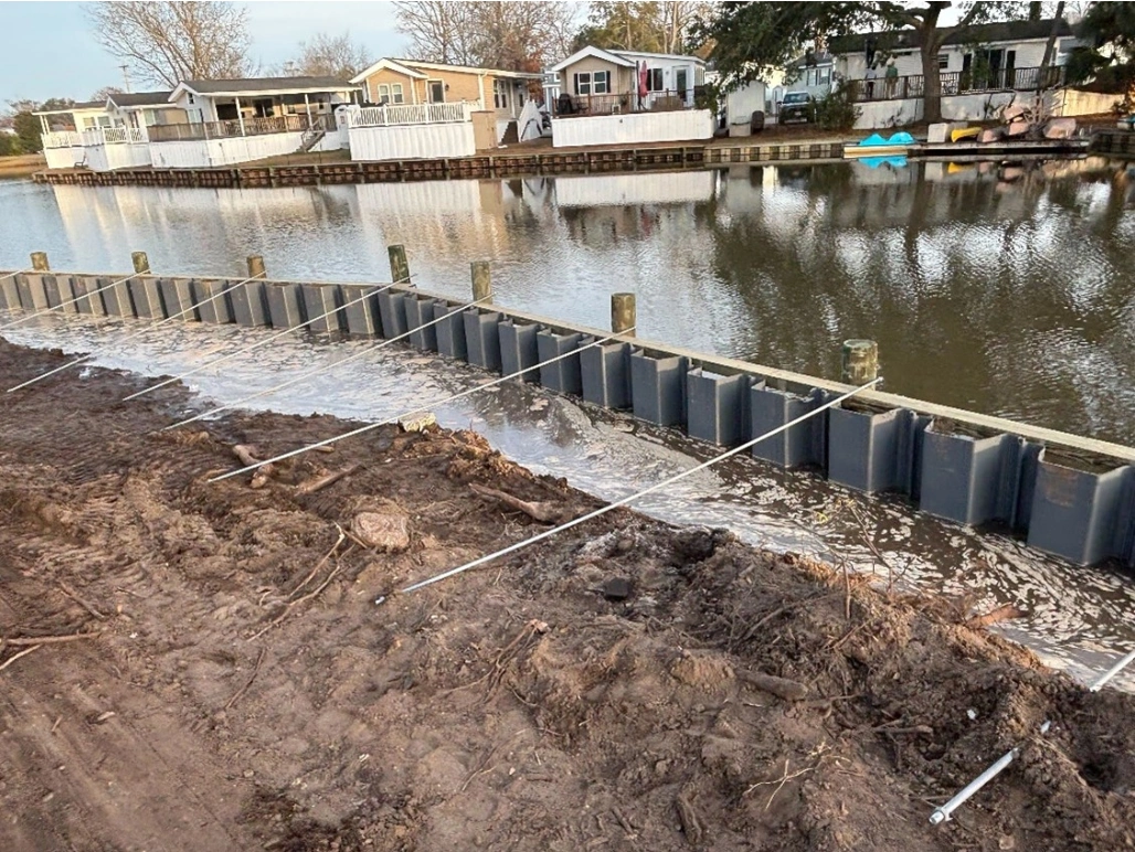 ESC vinyl sheet piling installed during shoreline improvement project to reinforce soil and upgrade waterfront edge